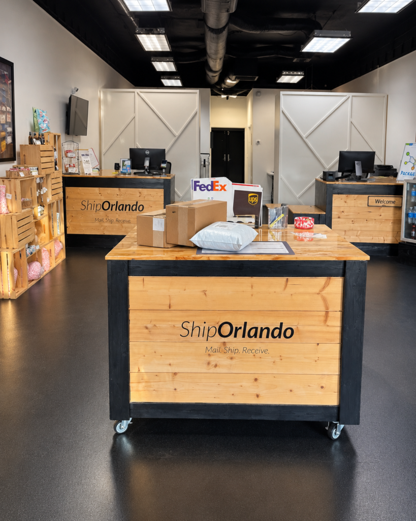 Ship Orlando package receiving area with customer packages placed on the counter inside the Edgewater Drive store in College Park.